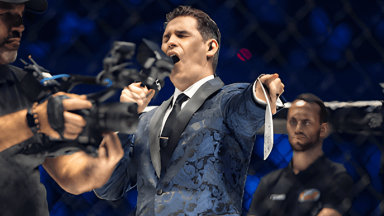 "Chad Fishburne, a renowned combat sports ring announcer, energizing the crowd with his signature catchphrase and electrifying presence."