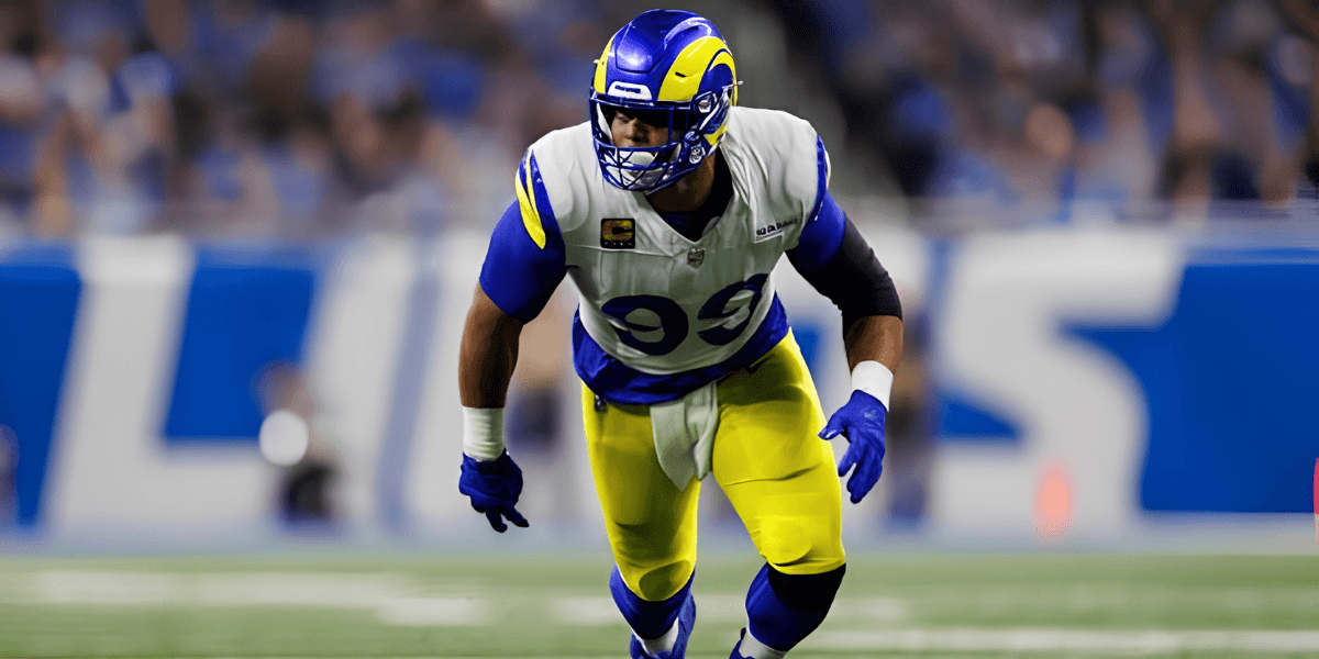 NFL player in blue and yellow uniform poised for action on the field