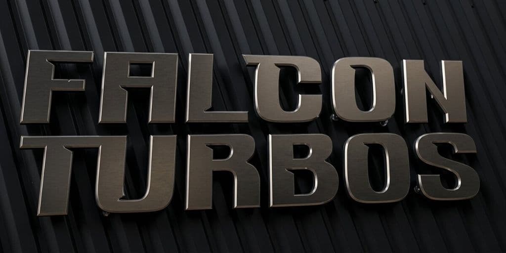 Metallic Falcon Turbos logo mounted on black textured wall background.