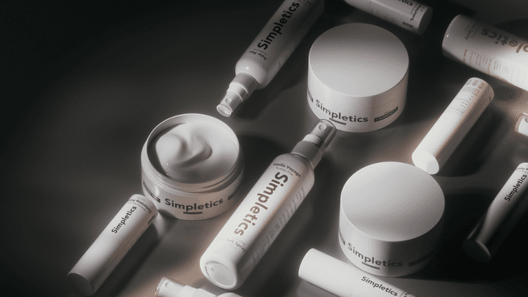 Simpletics hair care products arranged aesthetically, highlighting minimalist packaging and natural ingredient branding.