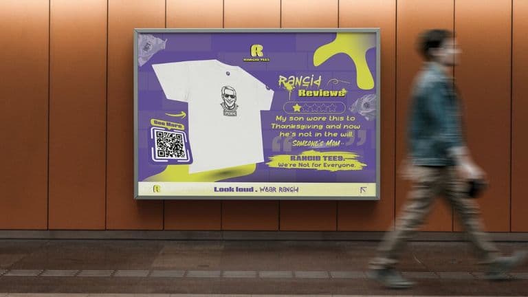 A man walks past a vibrant Rancid Tees poster showcasing bold, playful t-shirt designs that encourage self-expression.