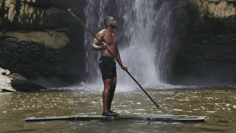 Chaz Ferguson embracing nature, symbolizing strength and resilience.