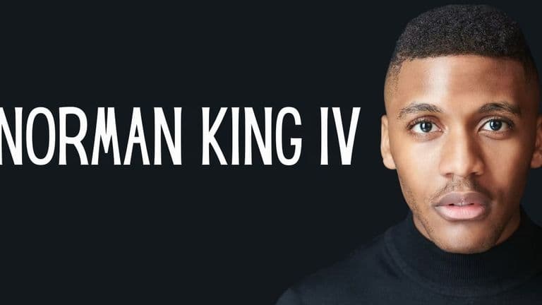Norman King IV, an international filmmaker, smiling confidently, representing his global storytelling and dedication to impactful narratives.