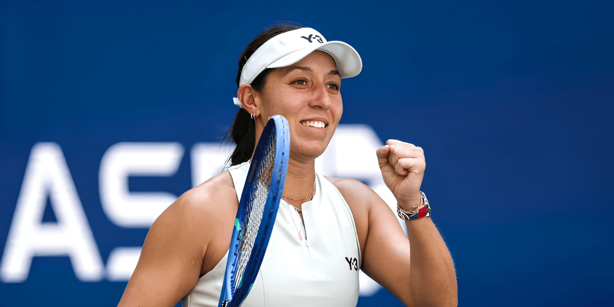 Tennis player celebrating a victory, holding her racket and smiling confidently
