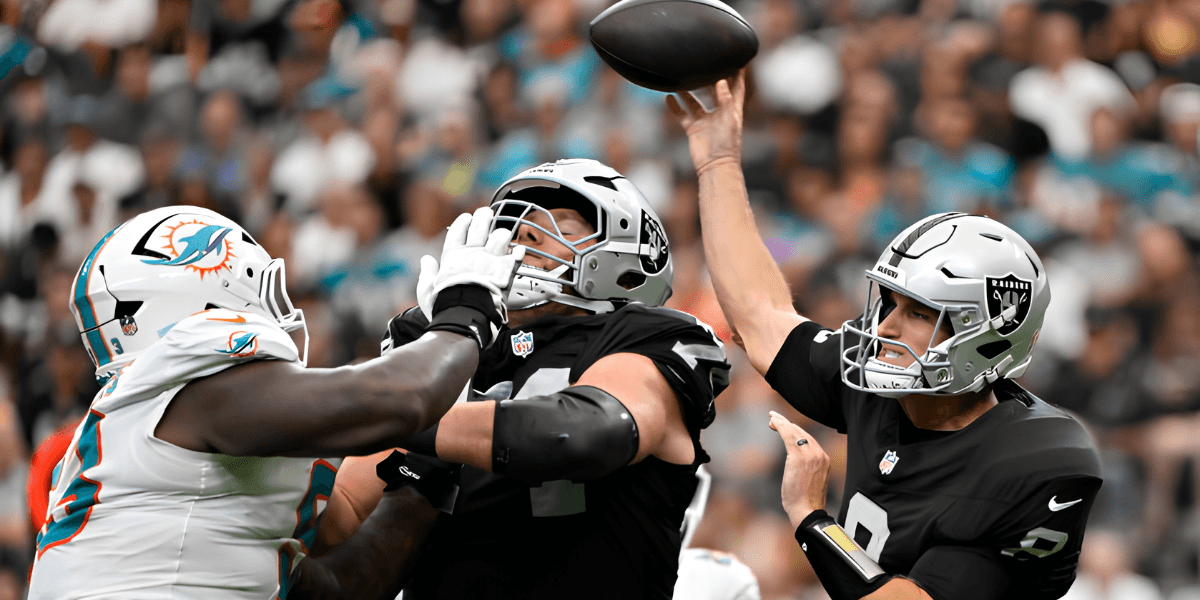 Football players in action during an NFL game, one throwing a pass under pressure