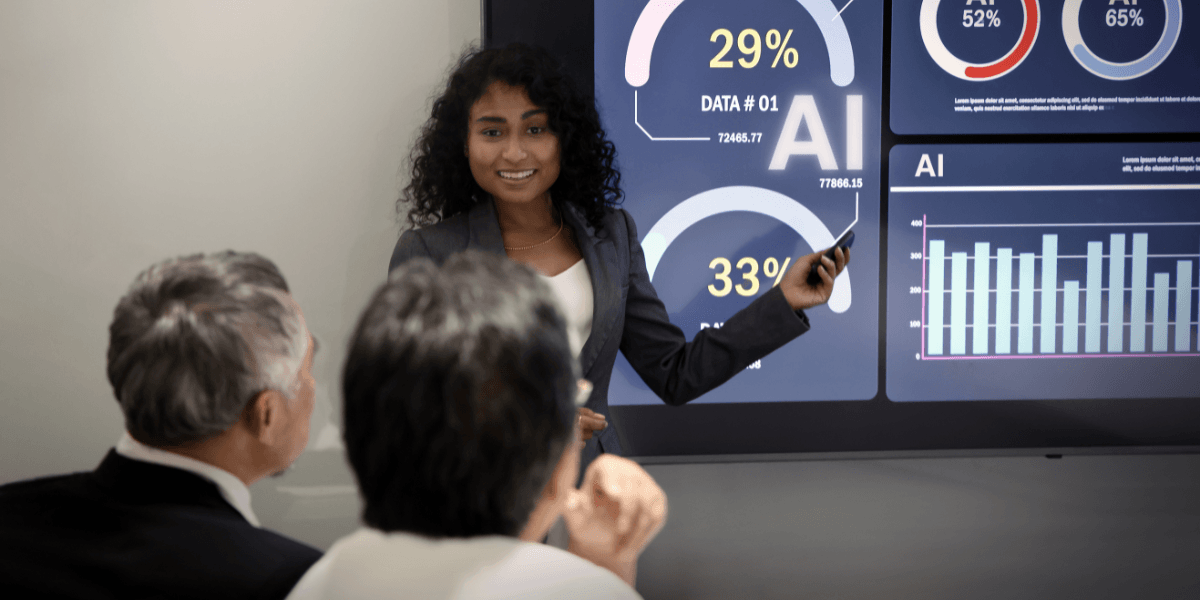 Businesswoman presenting data insights on a digital screen to two viewers in a meeting