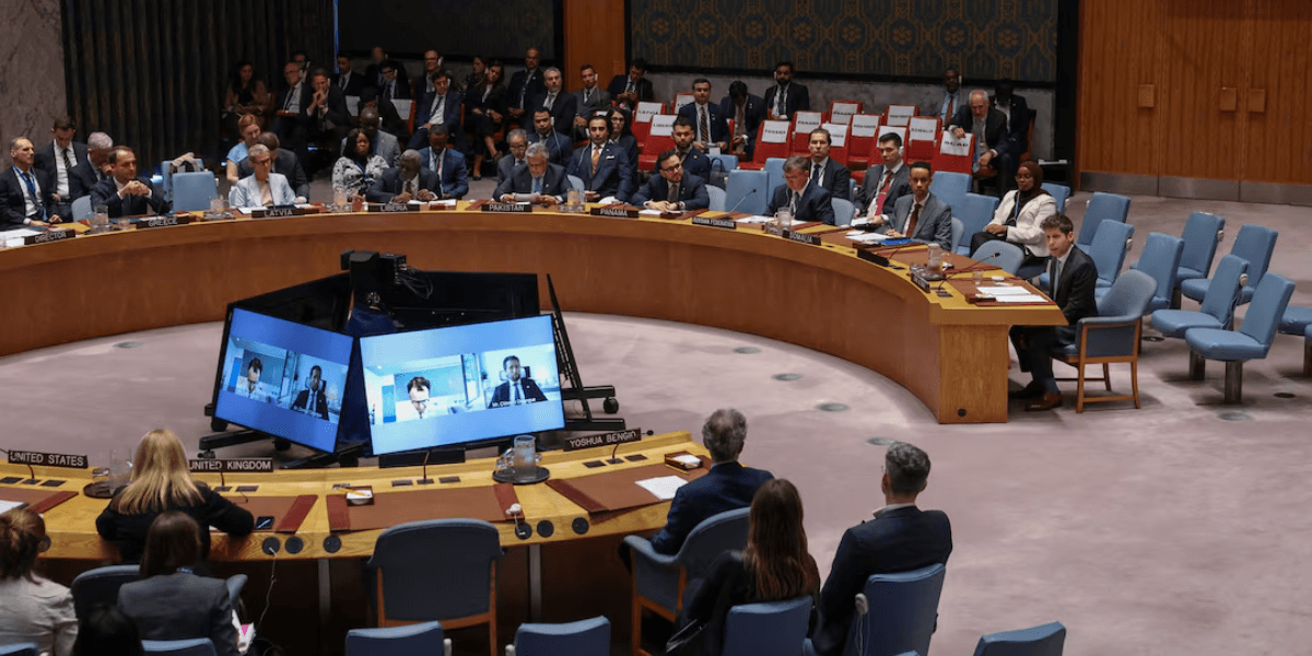 United Nations Security Council meeting with delegates seated around a circular table