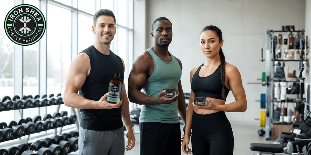 Three athletes stand together in a gym, proudly holding Iron Shea Muscle Recovery products to support their recovery journey.