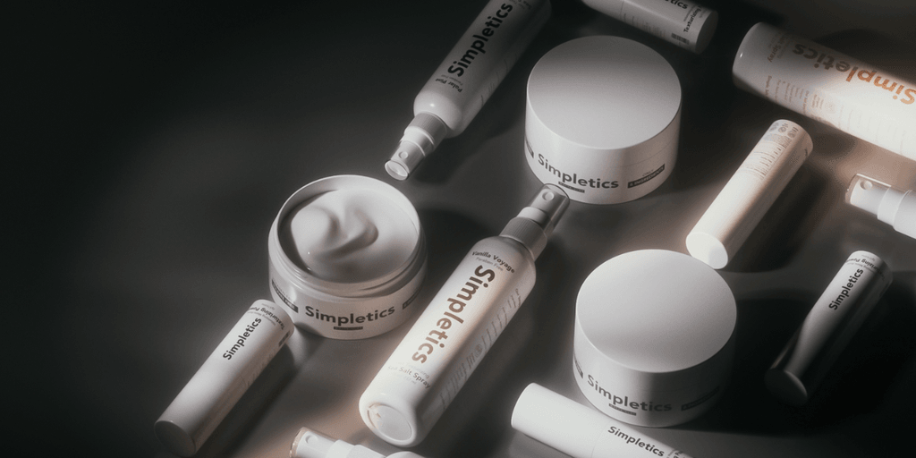 Simpletics hair care products arranged aesthetically, highlighting minimalist packaging and natural ingredient branding.