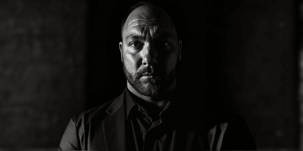 Portrait of Sean Barrite, reflecting strong leadership and focus, embodying the principles of behavior-based business success.