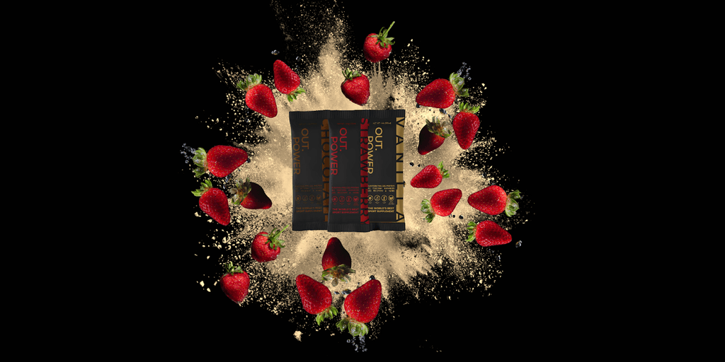Out.Power product surrounded by strawberries and supplement powder, showcasing flavors and product design.