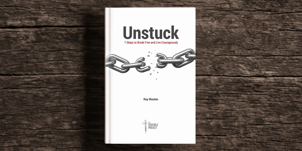 "Book cover of 'Unstuck' by Roy Wooten, featuring broken chains symbolizing personal growth and leadership transformation."