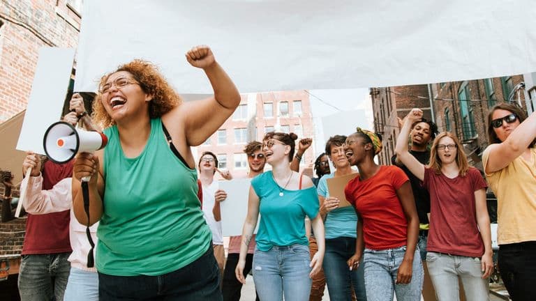Americans Participate in ‘Free America Walkout’ to Mark Inauguration Anniversary