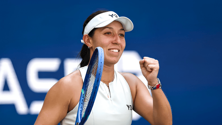 Tennis player celebrating a victory, holding her racket and smiling confidently