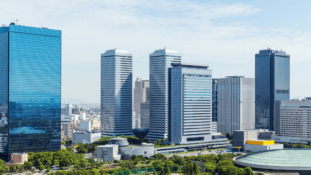 Skyline view of modern buildings in a city with clear blue skies