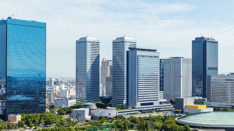 Skyline view of modern buildings in a city with clear blue skies