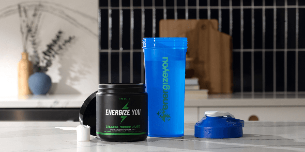 Fitness products including a shaker cup and energy supplement container on a kitchen counter