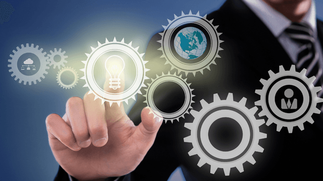 Businessman interacting with gears representing ideas, technology, and collaboration concepts
