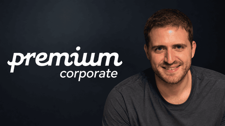 Young man smiling in a gray shirt next to a logo for Premium Corporate