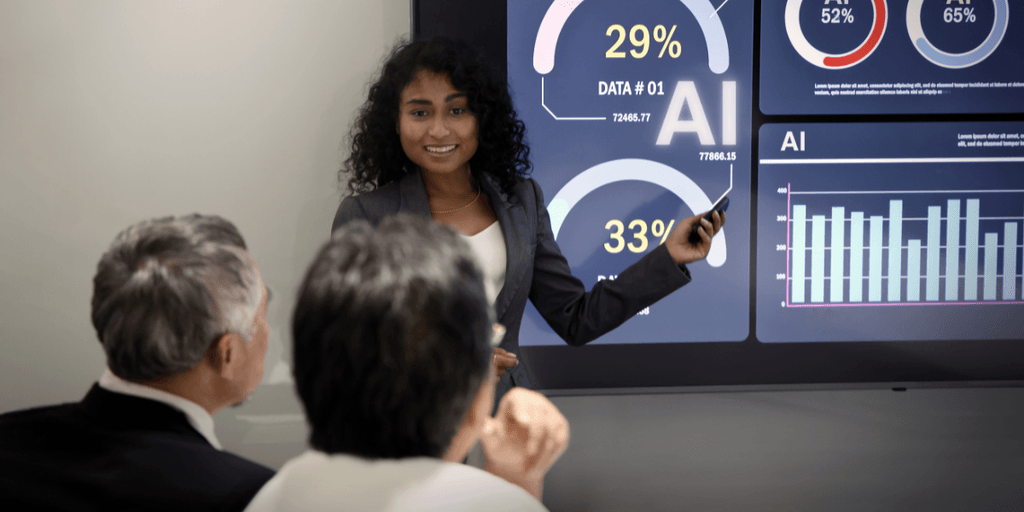 Businesswoman presenting data insights on a digital screen to two viewers in a meeting
