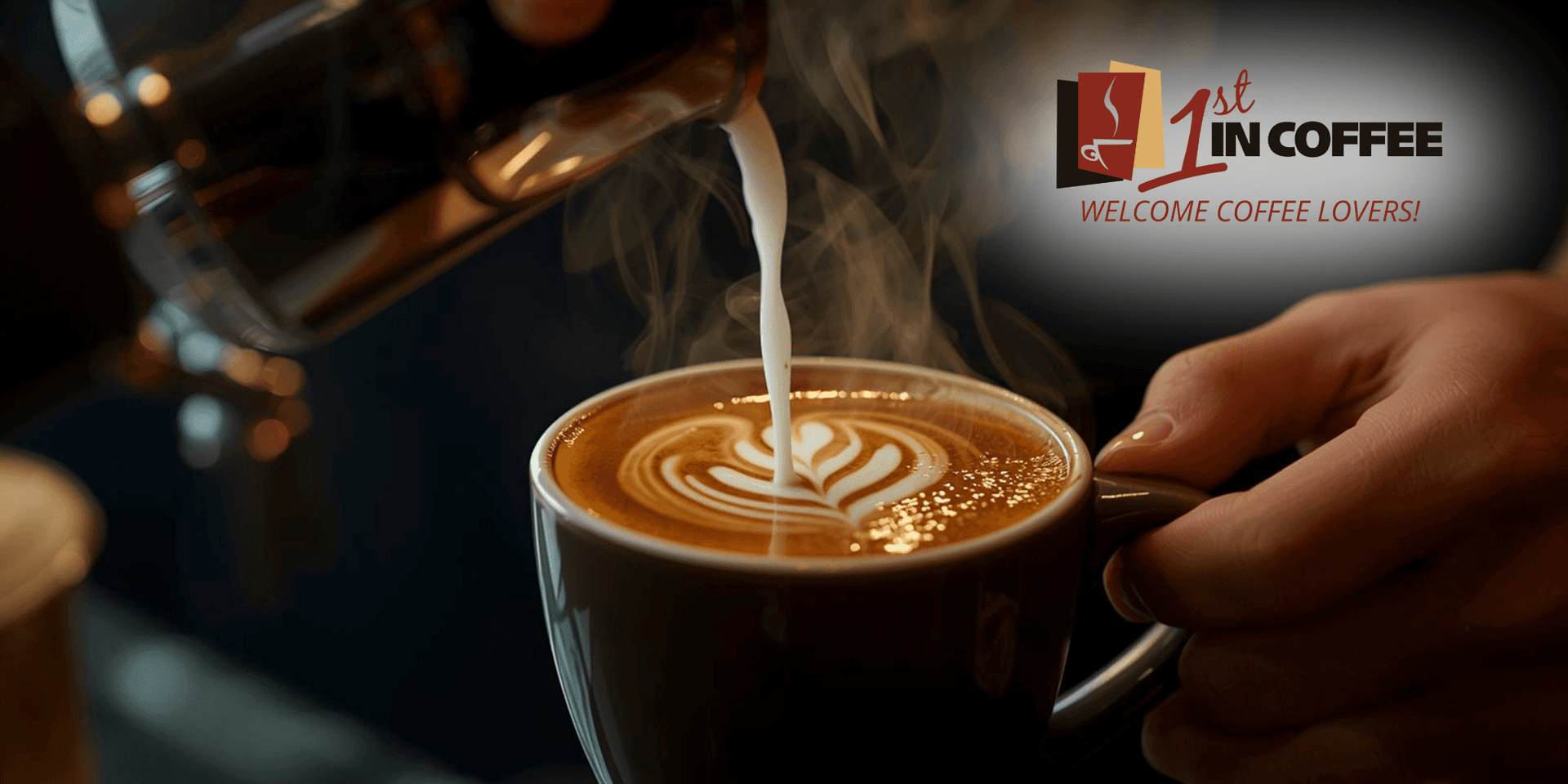 Coffee being poured with frothy milk creating a leaf design in a cup