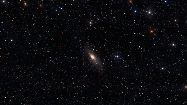 A vast starry sky featuring the Andromeda galaxy and numerous other stars