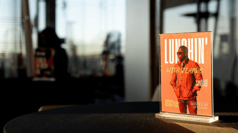 Promotional display for Lunchin’ with O’Lanre, a talk series blending culture, entrepreneurship, and community discussions hosted by O'Lanre.