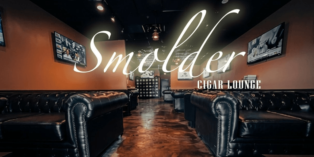 Interior of Smolder Cigar Lounge with leather sofas, TVs, warm lighting, and elegant signage.