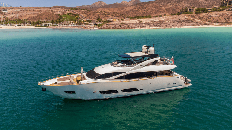Luxury yacht anchored near a scenic coastline in Baja California Sur, Mexico.