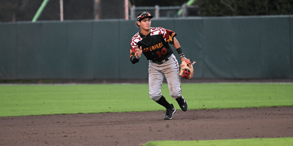Player in Shorebirds uniform running on the infield.