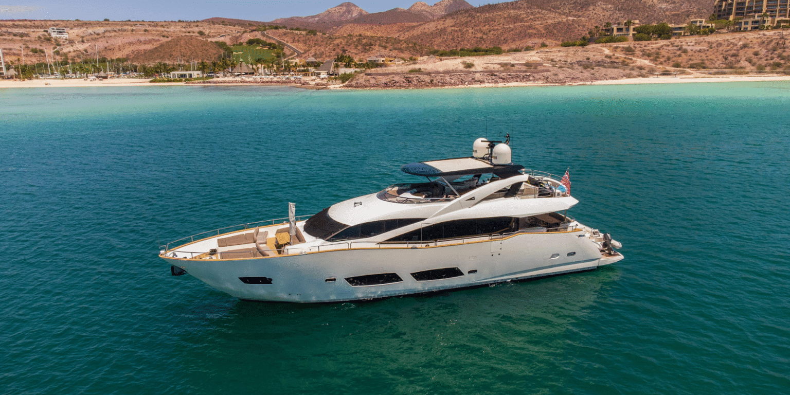 Luxury yacht anchored near a scenic coastline in Baja California Sur, Mexico.