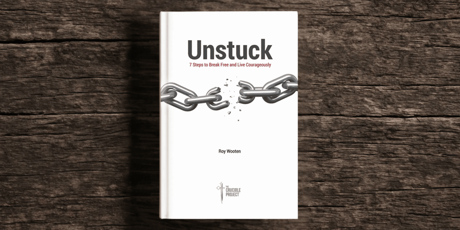 "Book cover of 'Unstuck' by Roy Wooten, featuring broken chains symbolizing personal growth and leadership transformation."